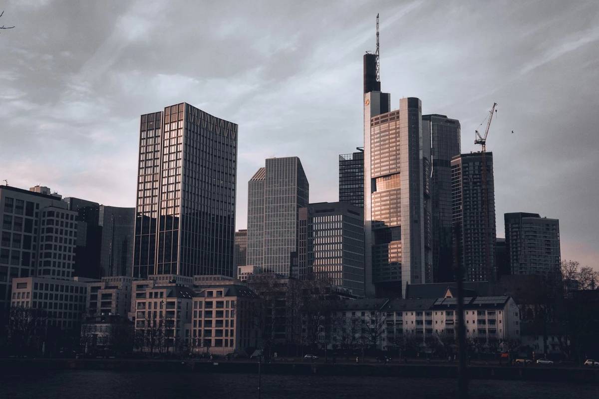 Financial-district skyline at dusk, evoking European private-equity fund management and the Luxembourg carried interest regime