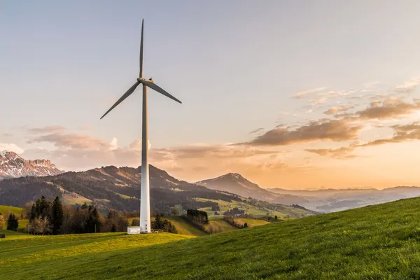 Wind turbine at sunset evoking the long-term infrastructure assets targeted by Luxembourg ELTIFs