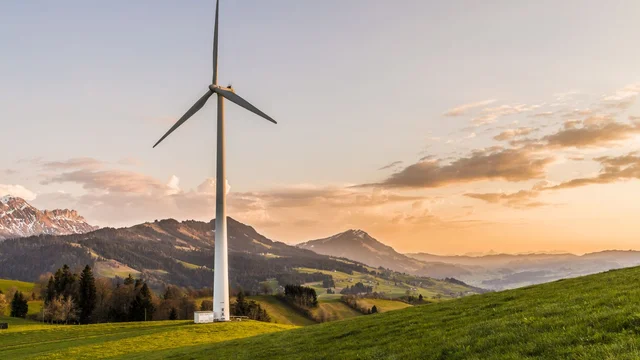 Wind turbine at sunset evoking the long-term infrastructure assets targeted by Luxembourg ELTIFs