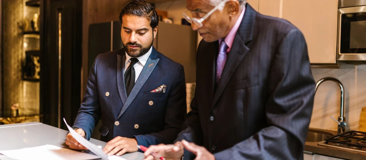 Executives reviewing financing documents in a meeting for a Luxembourg intragroup loan