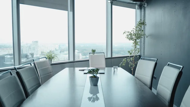 Modern boardroom with a panoramic city view, evoking an institutional Luxembourg private-equity office for an SCSp general partner