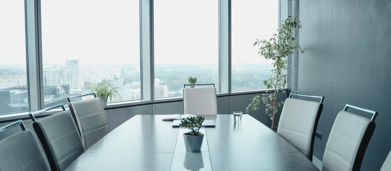 Modern boardroom with a panoramic city view, evoking an institutional Luxembourg private-equity office for an SCSp general partner
