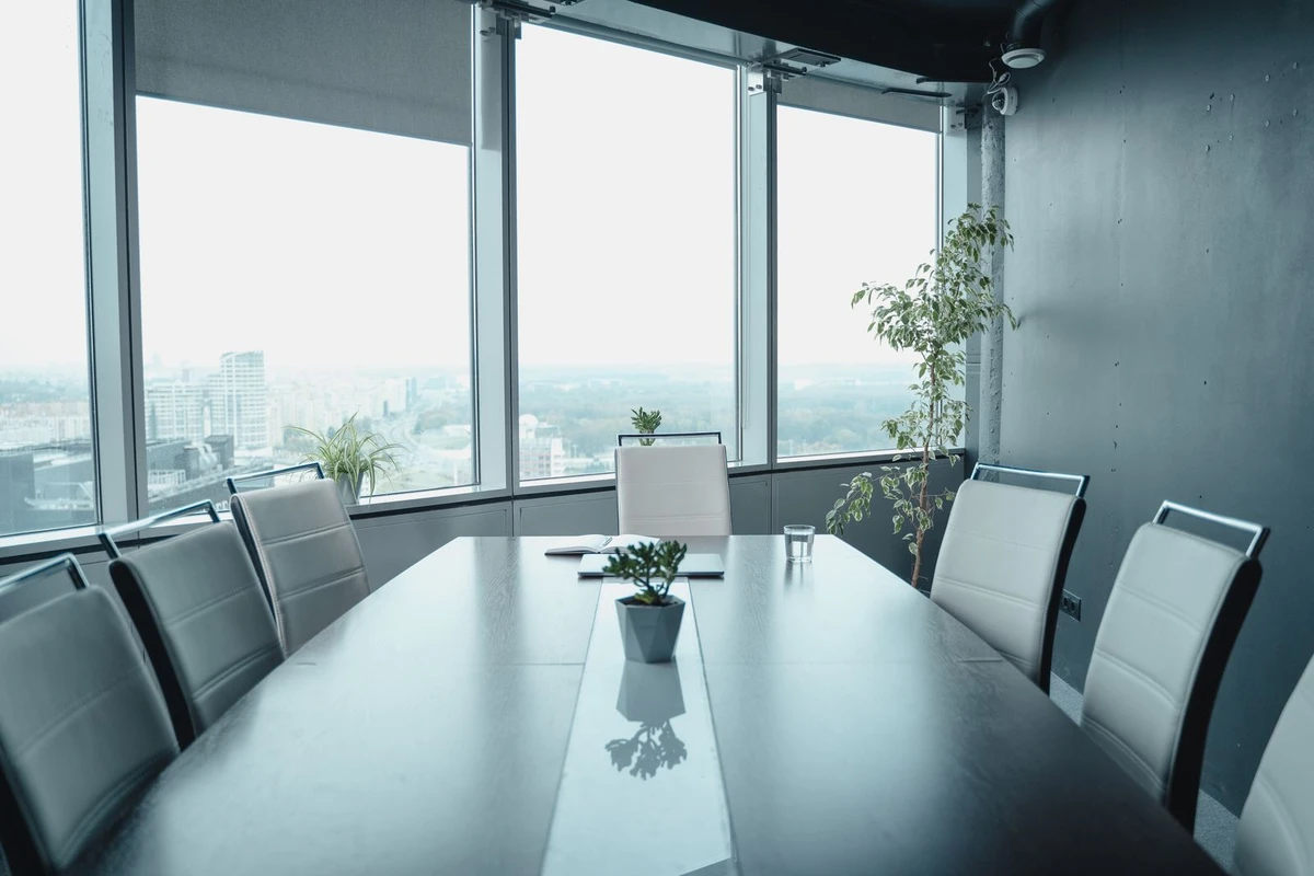 Modern boardroom with a panoramic city view, evoking an institutional Luxembourg private-equity office for an SCSp general partner